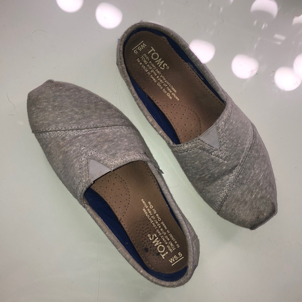 TOMS grey slip on’s